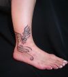 tribal pic tattoo on ankle